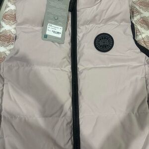 Canada Goose cream colored vest with black zipper